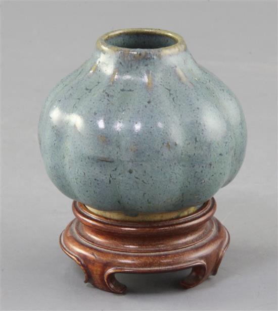A Chinese Jun-type lobed ovoid vase, 17th/18th century, height 6cm, wood stand